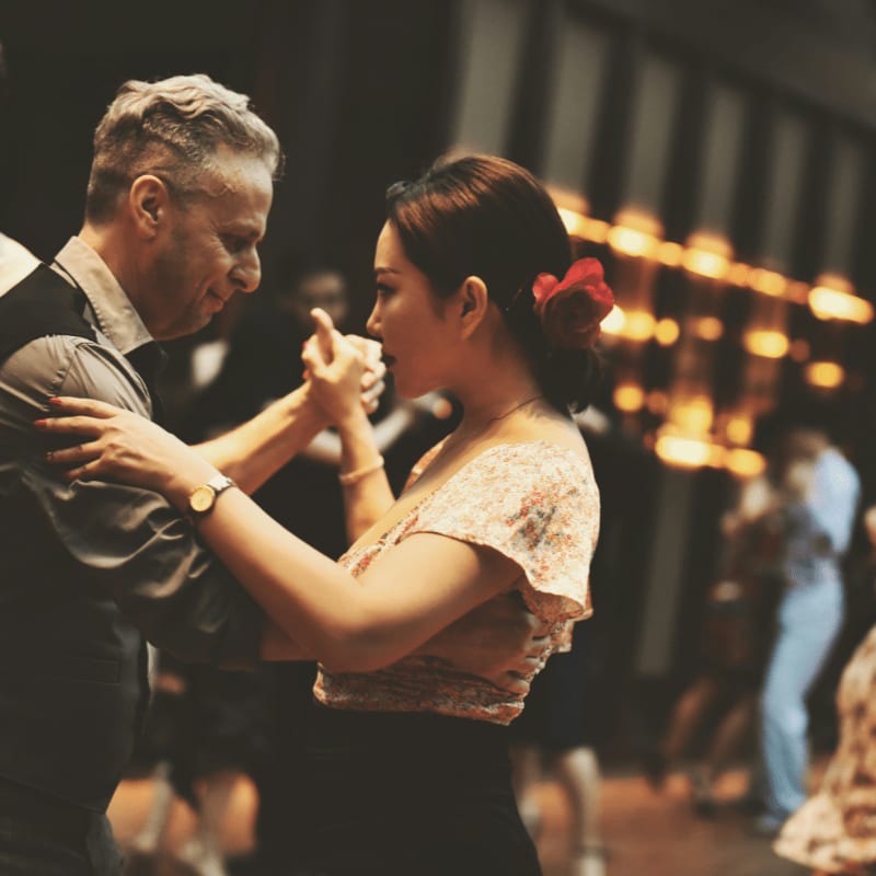 a couple of people that are dancing together
