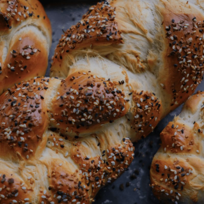 a close up of bread rolls with sesame seeds