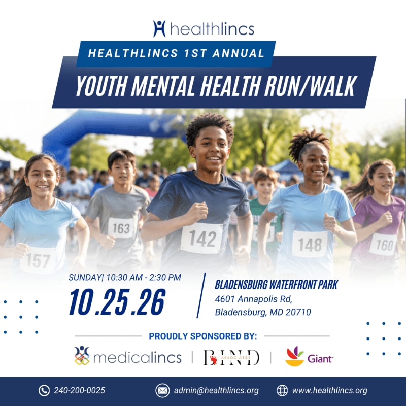 A group of smiling children run in a race with a banner for a youth mental health run/walk in the background.