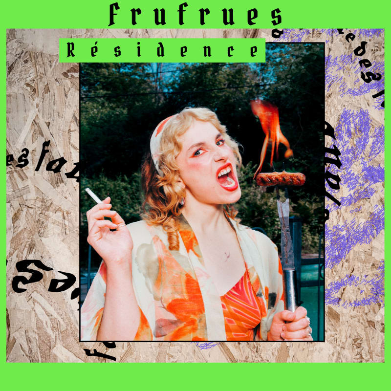 A woman with a cigarette in her left hand and a flaming hot dog on a fork in her right hand poses in front of a wooded background, framed by a green border with text.