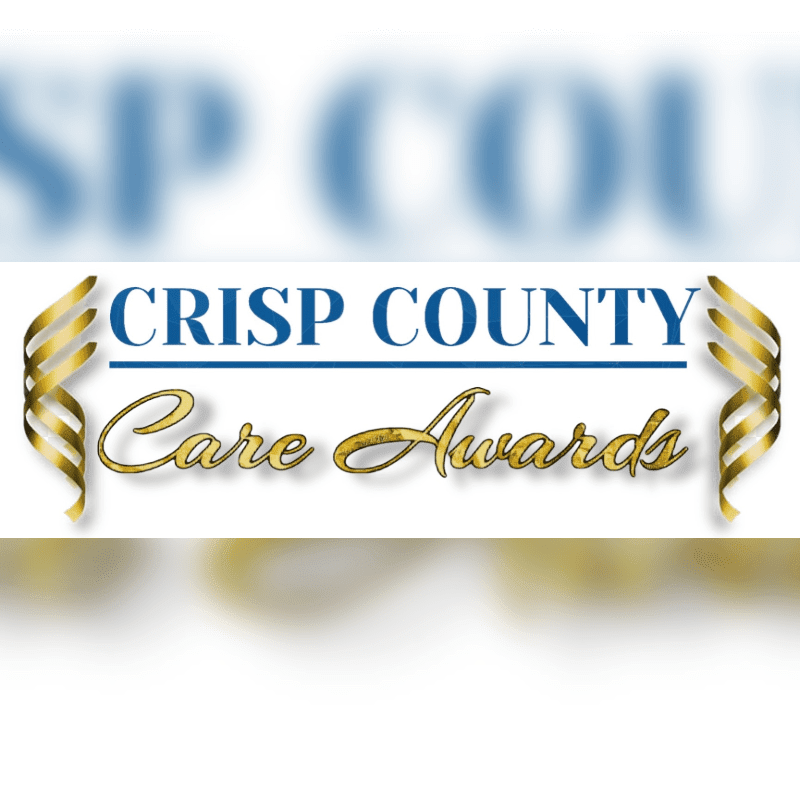 Golden laurels frame the "CRISP COUNTY Care Awards" logo against a blurred blue and white background.