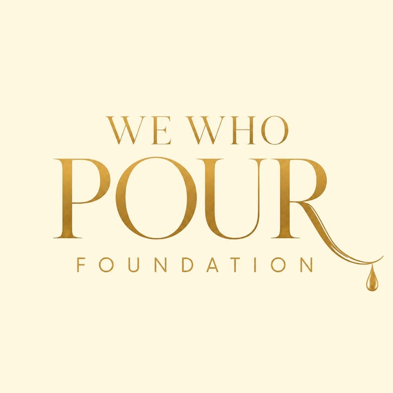 Golden text on a cream background reads "WE WHO POUR FOUNDATION" with a droplet of liquid falling from the "R" in "POUR".