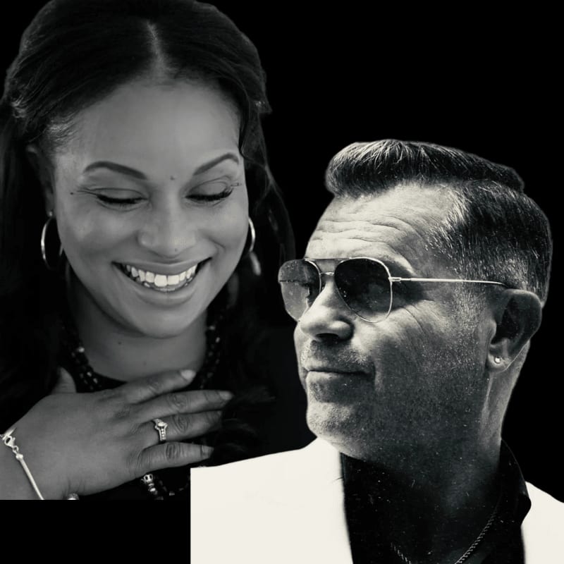 A smiling woman with hoop earrings and a man in sunglasses and a white jacket are set against a black background.