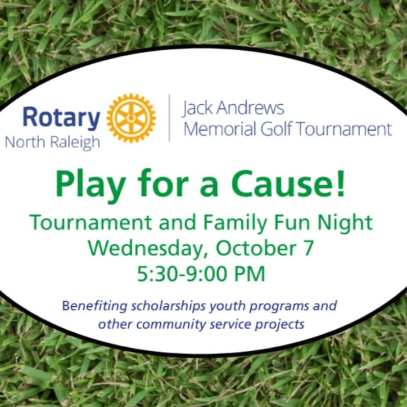 Green grass fills the foreground behind a white oval containing text about the Jack Andrews Memorial Golf Tournament.