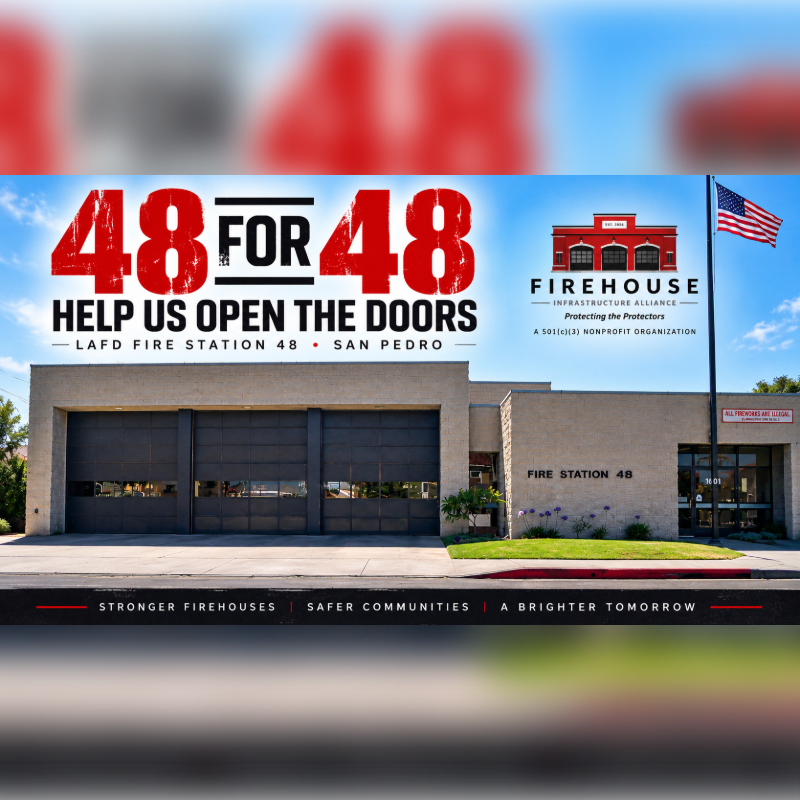 A modern fire station with large bay doors in the foreground is set against a bright sky with a large red and white "48 FOR 48" graphic and an American flag in the background.