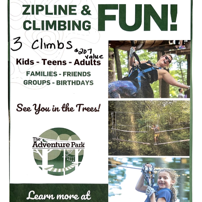 A flyer advertises ziplining and climbing fun at The Adventure Park, featuring images of people enjoying the activities in a wooded setting.