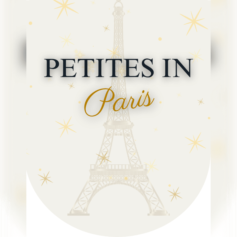 A stylized Eiffel Tower with the words "PETITES IN Paris" in the foreground stands against a background of scattered golden stars on a cream-colored circular canvas.