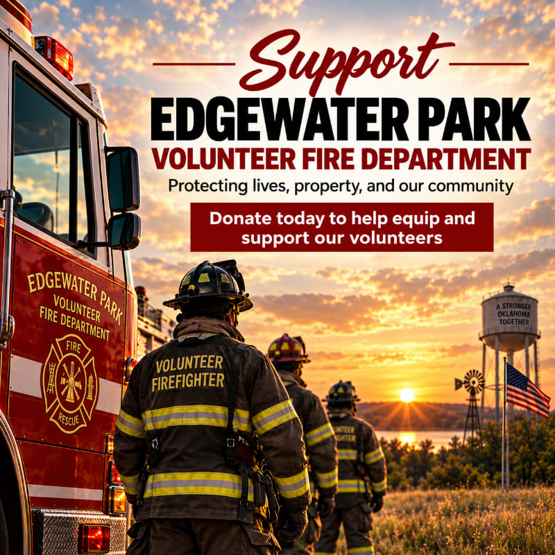 Three volunteer firefighters stand beside a fire truck in the foreground, with a sunset over a lake and a water tower in the background.