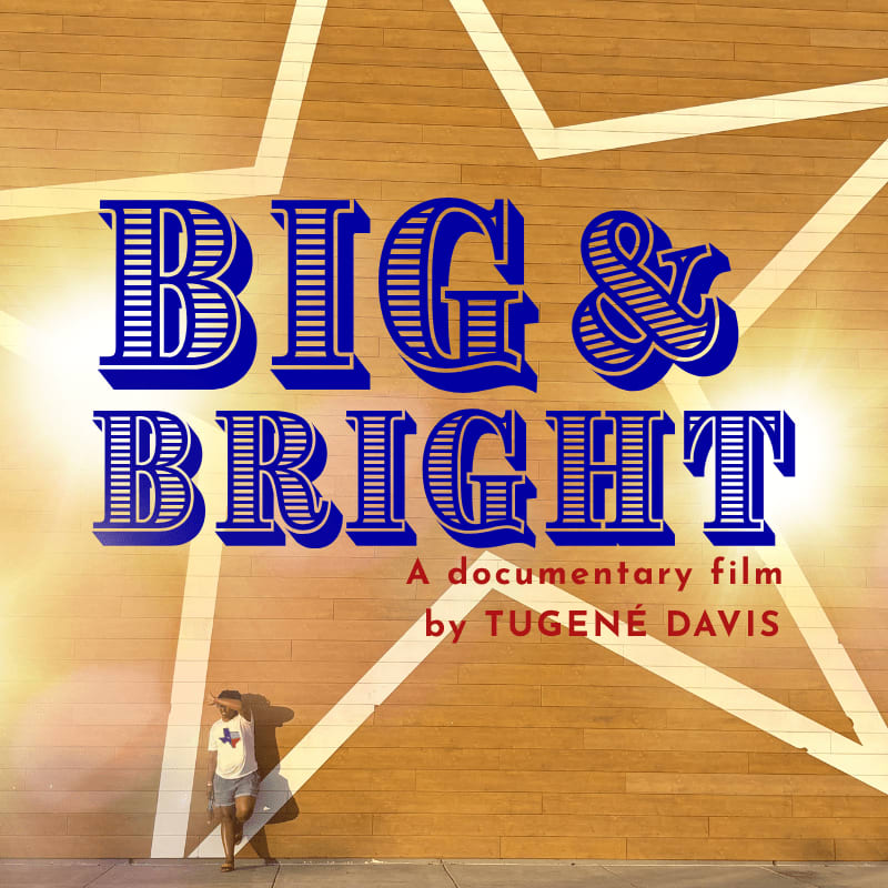 A man stands in the foreground looking up at a large star-shaped mural with the words "BIG & BRIGHT" emblazoned across it.
