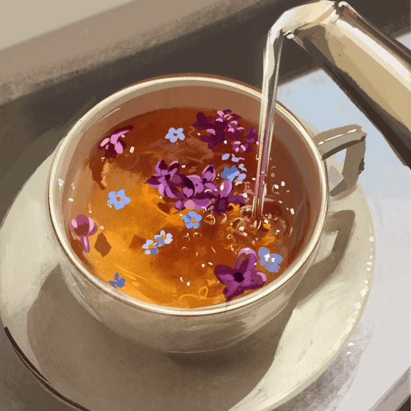 A stream of amber liquid pours into a teacup filled with purple and blue flowers, set against a softly blurred background.