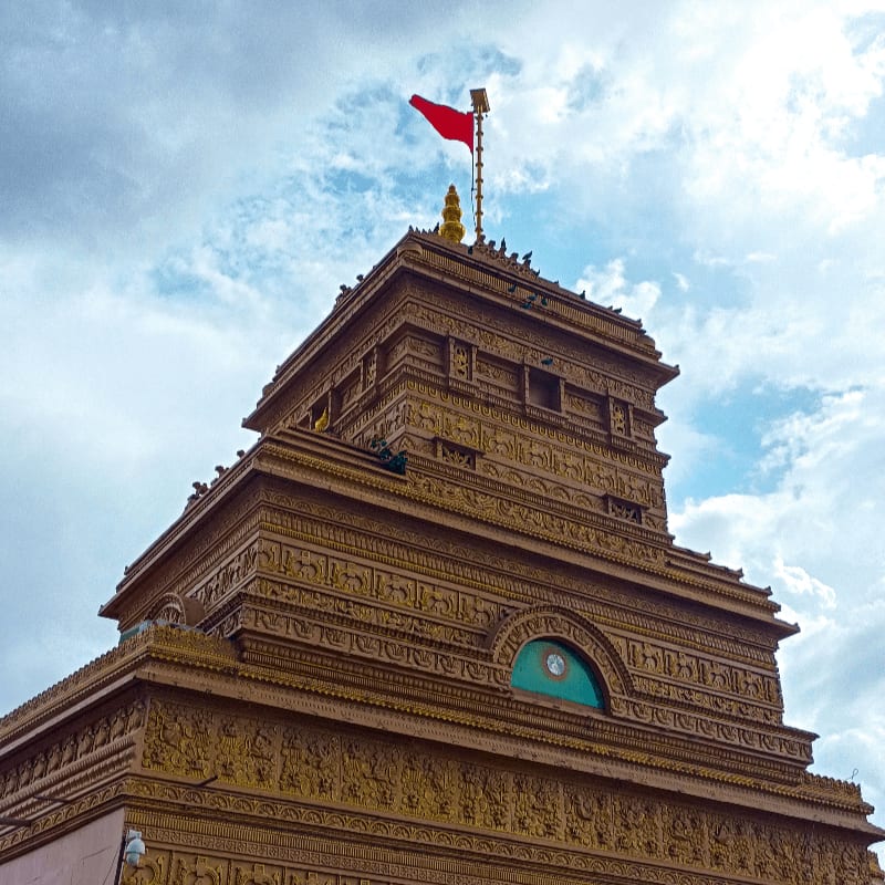 a tall tower with a flag on top of it