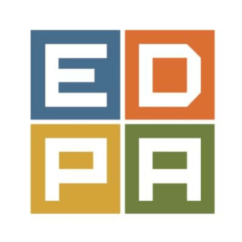 Four colored squares, each containing a white letter, form a larger square in the foreground, set against a plain white background.