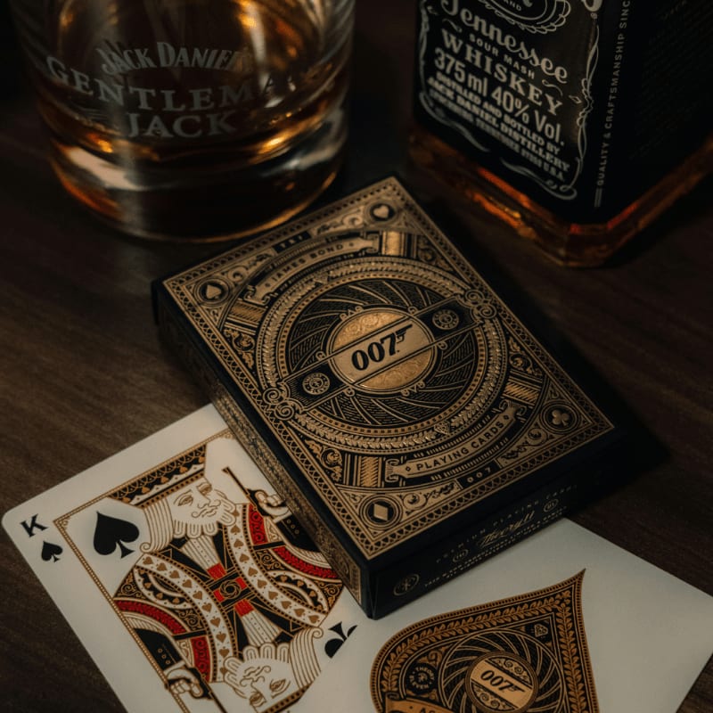 Jack daniel's, a deck of cards, and a glass