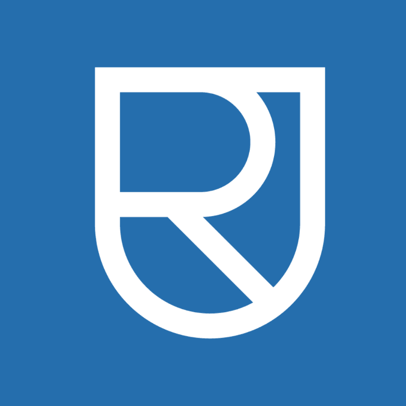 A white stylized shield with the letters "RJ" inside is centered on a solid blue background.
