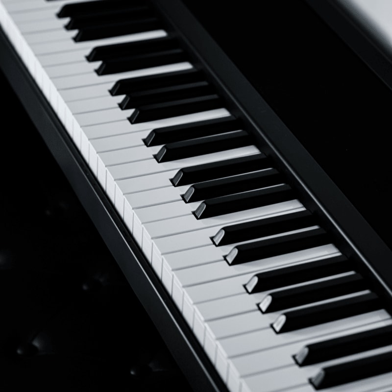 a close up of a piano keyboard on a table