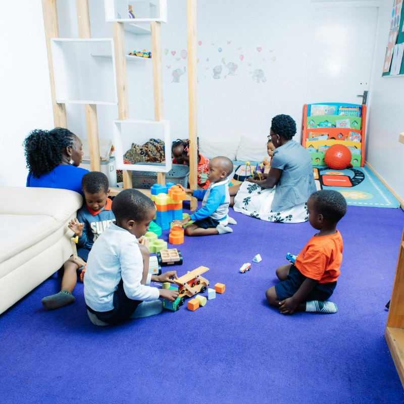 Children playing with toys in a bright room