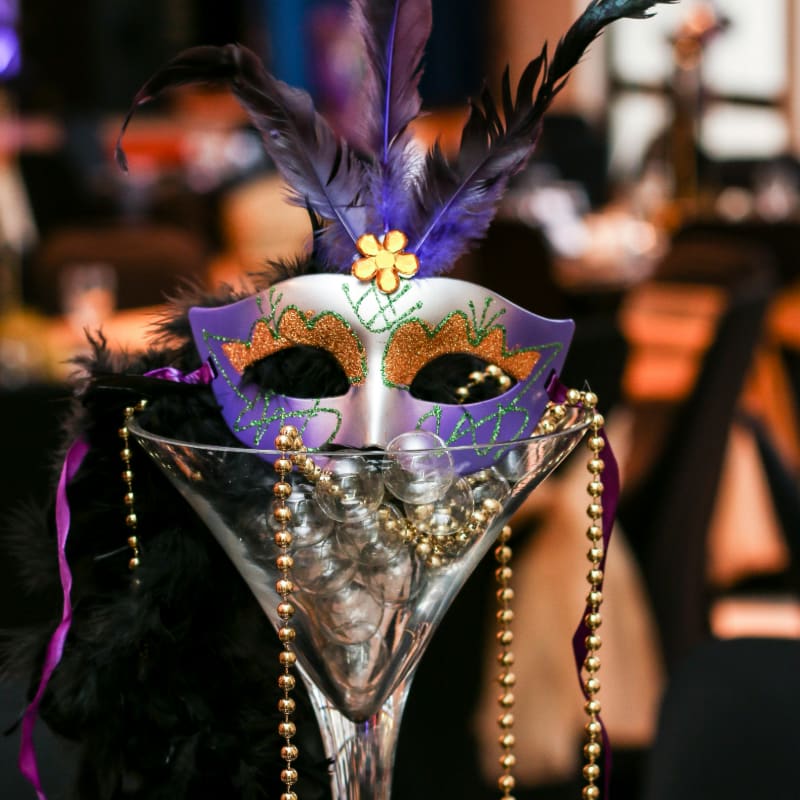 purple and white masquerade mask