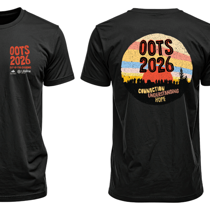 A black t-shirt displays "OOTS 2026" in orange on the left chest, while the back features a circular sunset graphic with "OOTS 2026" above the words "CONNECTION UNDERSTANDING HOPE" in a silhouetted forest.