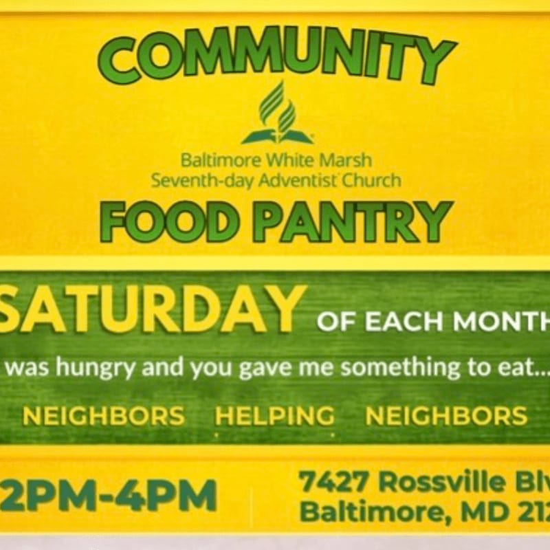 A bright yellow sign advertises the Baltimore White Marsh Seventh-day Adventist Church Community Food Pantry, with details about its Saturday hours and location in the foreground.