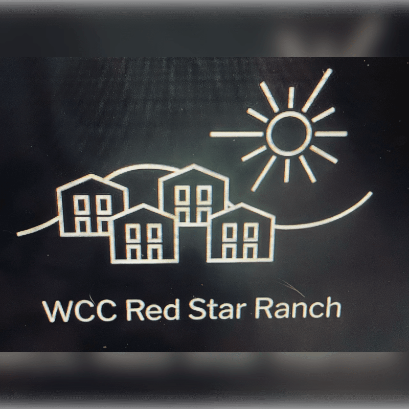 A stylized white line drawing of houses and a sun sits above the text "WCC Red Star Ranch" on a dark background.