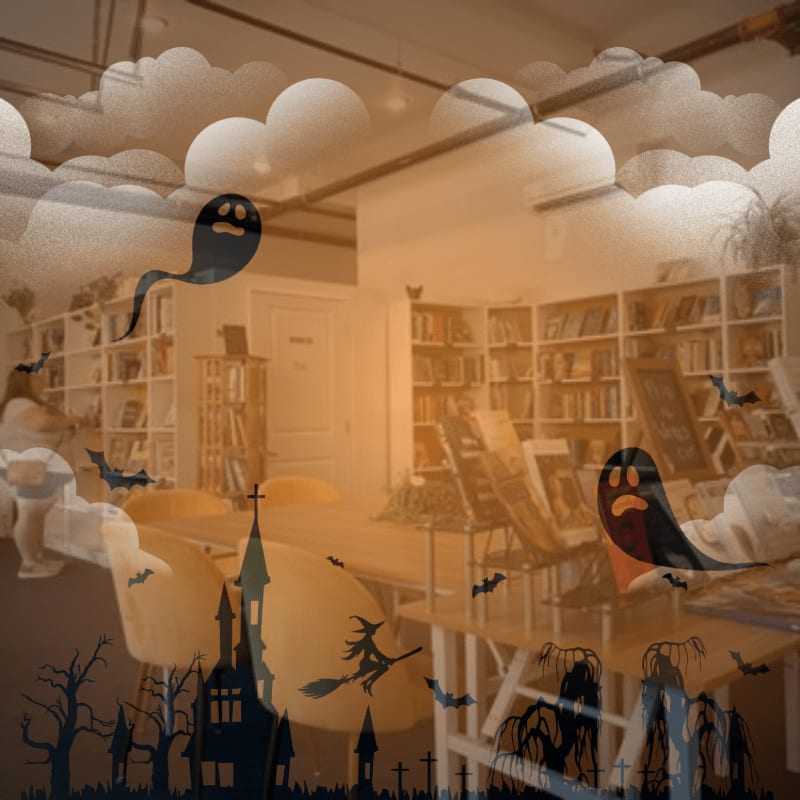 A large pink framed poster with a heart-shaped graphic is in the foreground, while the background reveals a brightly lit bookstore with shelves of books and decorative elements.