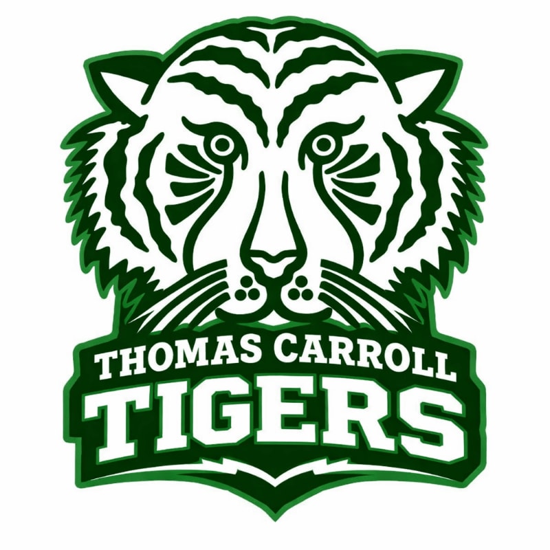 A stylized green and white tiger head with "THOMAS CARROLL TIGERS" written below it is set against a plain white background.