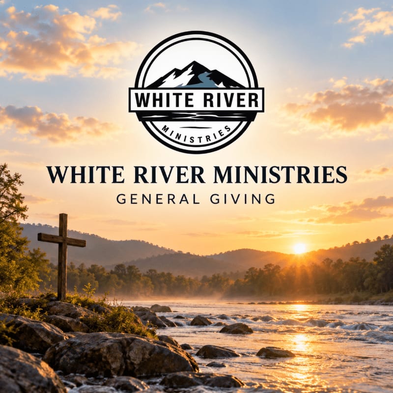 A wooden cross stands on rocky ground in the foreground, with a river flowing through a valley at sunset in the background, all under a logo for "White River Ministries."