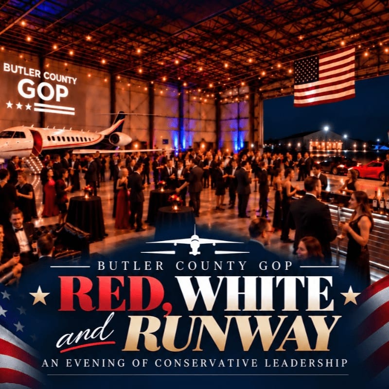 A formal event with people in the background and a flyer for a "Butler County GOP Hangar Party" in the foreground.
