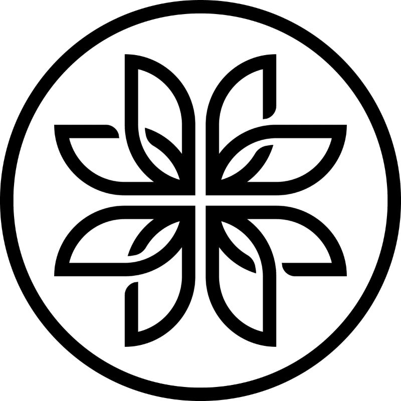 A black and white circular logo features a stylized four-petal flower design in the foreground, set against a plain white background.