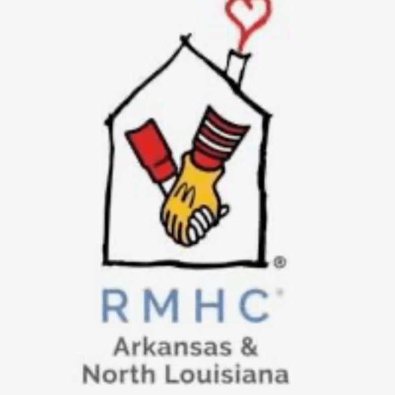 A logo featuring two hands shaking inside a house outline with a heart-shaped smoke plume, set against a plain white background with "RMHC Arkansas & North Louisiana" text below.