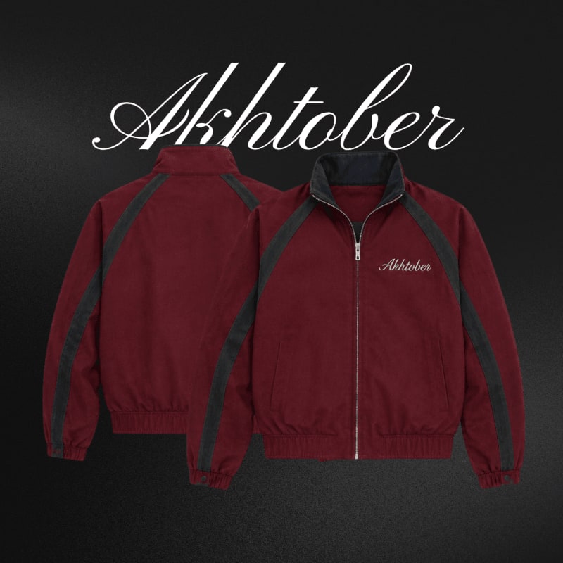 Two maroon and grey jackets are displayed against a dark background with the word "Akhtober" written in white cursive above them.