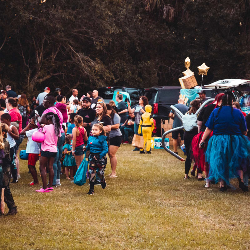 a large group of people standing around each other