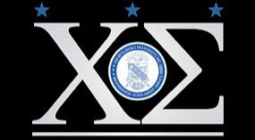 White Greek letters and a circular emblem are centered against a black background with three blue stars above.