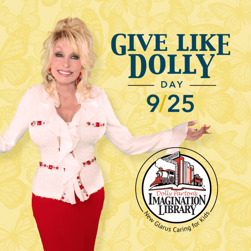 Dolly Parton stands in the foreground next to "Give Like Dolly Day" text and a logo, set against a yellow background with butterfly patterns.