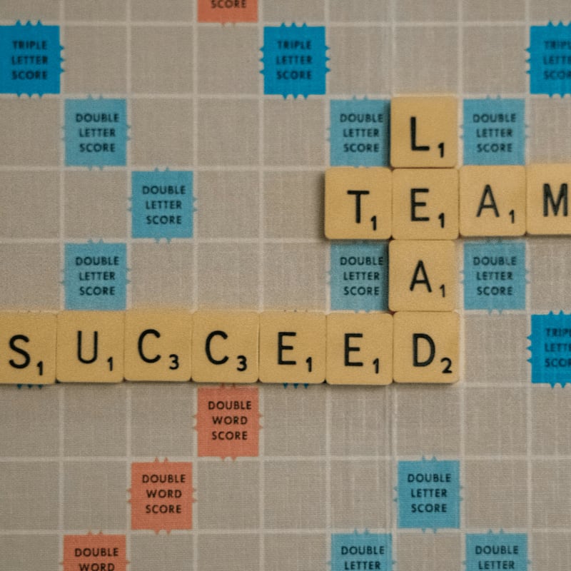 scrabbled scrabble tiles with words on them