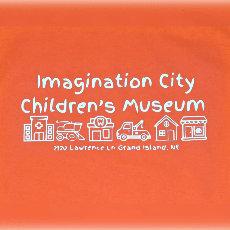 White text and hand-drawn building icons for the Imagination City Children's Museum are centered on a solid orange background.