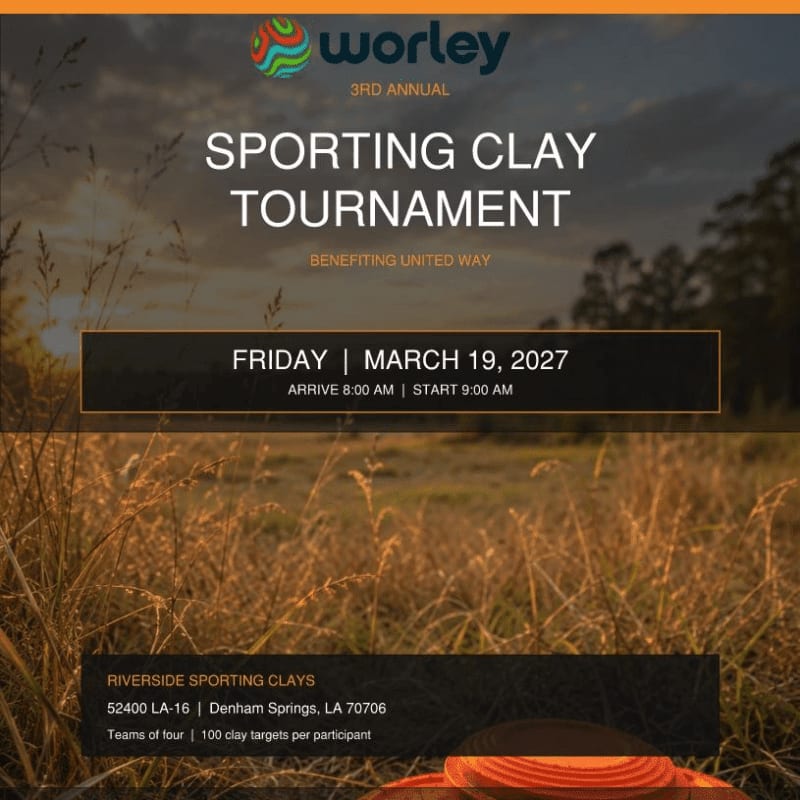 Text announcing a sporting clay tournament is overlaid on a landscape of golden grass in the foreground and a soft, sunset sky with distant trees in the background.