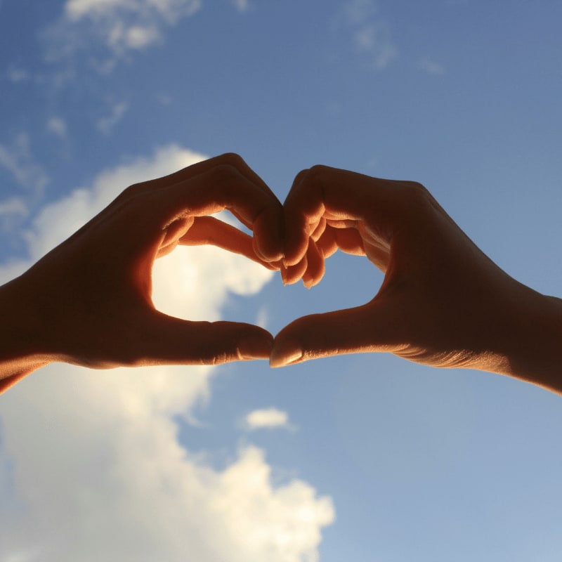 2 hands forming heart shape