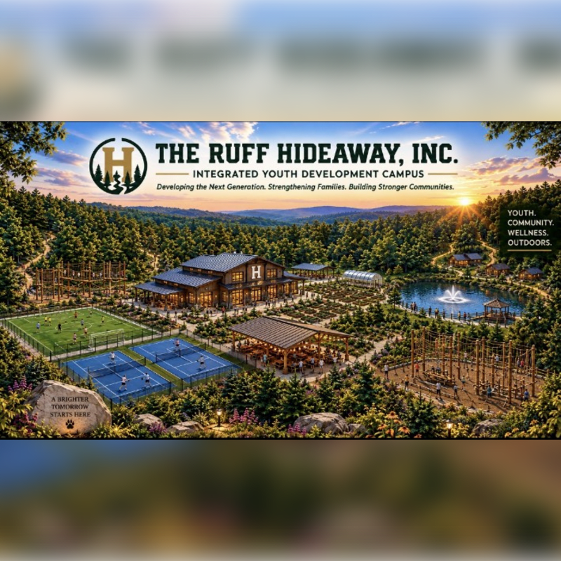 A youth development campus featuring sports courts, a main lodge, and a fountain in the foreground, set against a backdrop of rolling forested hills under a sunset sky.