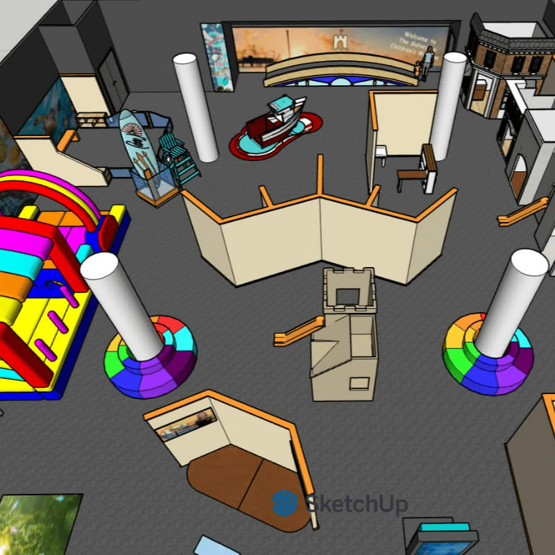 A colorful inflatable slide and play structure dominate the foreground, while the background reveals a museum-like exhibit with displays and architectural models.