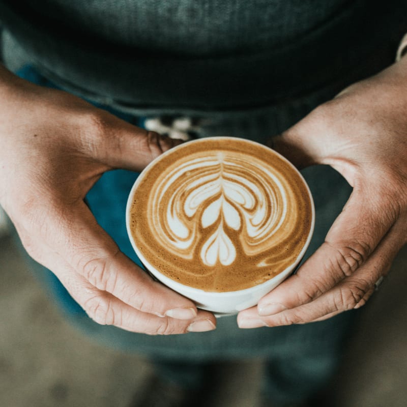 focus photography of coffee artwork
