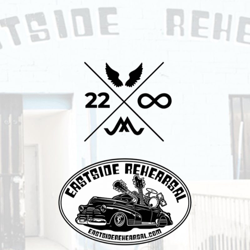 Two black and white logos are centered in the foreground over a faded, bright background of a building entrance with the words "EASTSIDE REHEARSAL" visible.