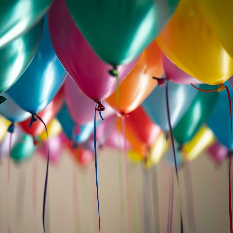selective focus photography of assorted-color balloons