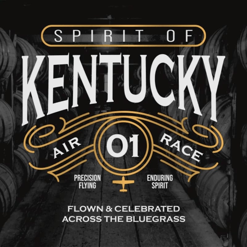 Bold white and gold text promoting the "Spirit of Kentucky Air Race" is layered over a background of wooden barrels in a dark warehouse.