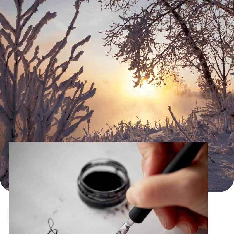 A hand dipping a pen into a black inkwell is superimposed over a snowy winter landscape with frost-covered branches and a glowing sunset.