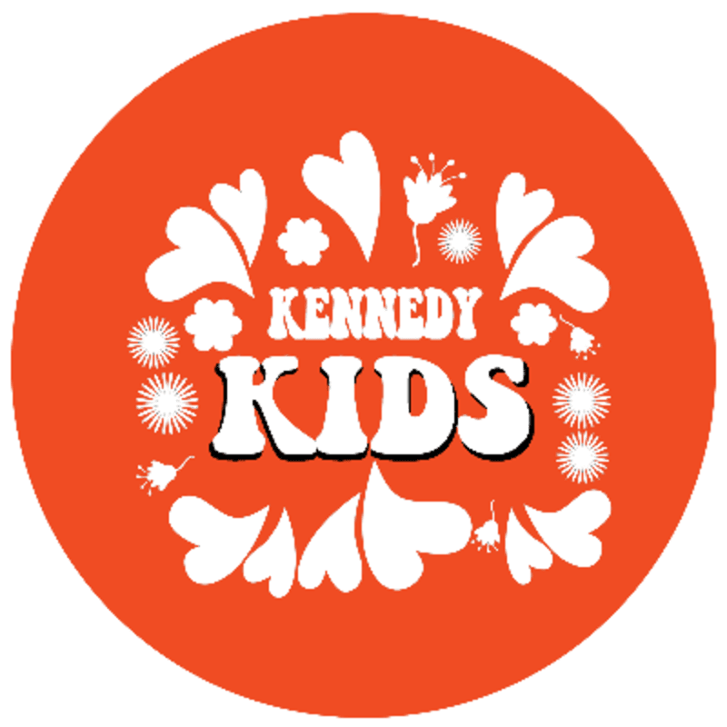 White text reading "KENNEDY KIDS" and whimsical floral illustrations are centered on a solid orange circular background.