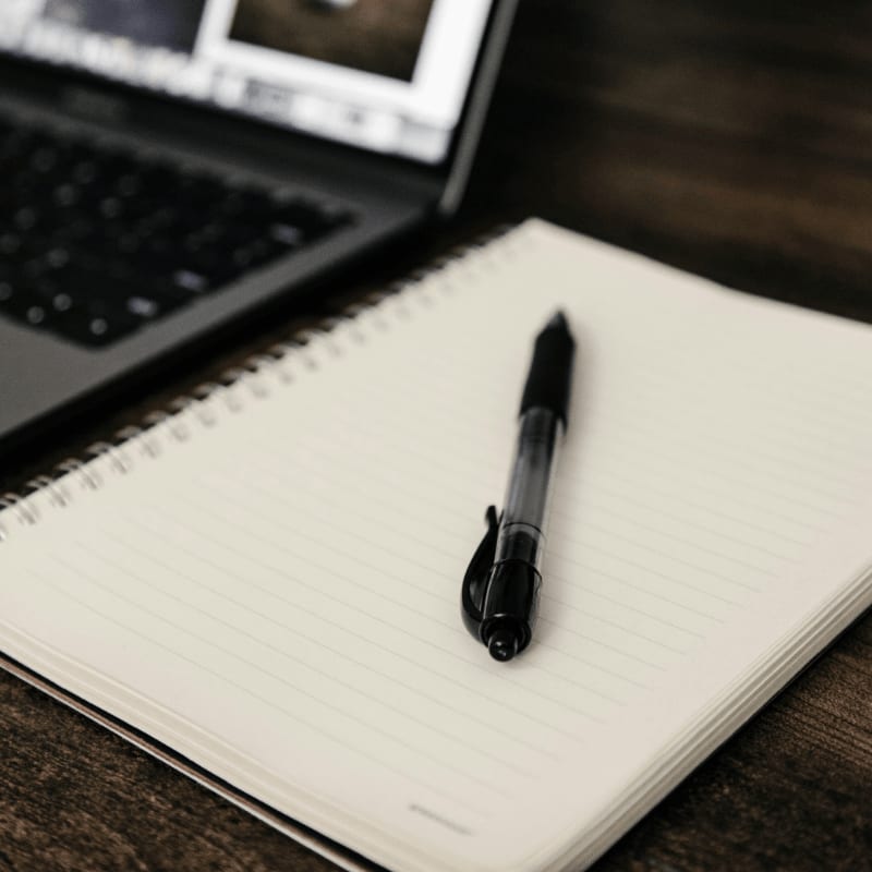 black pen on notebook