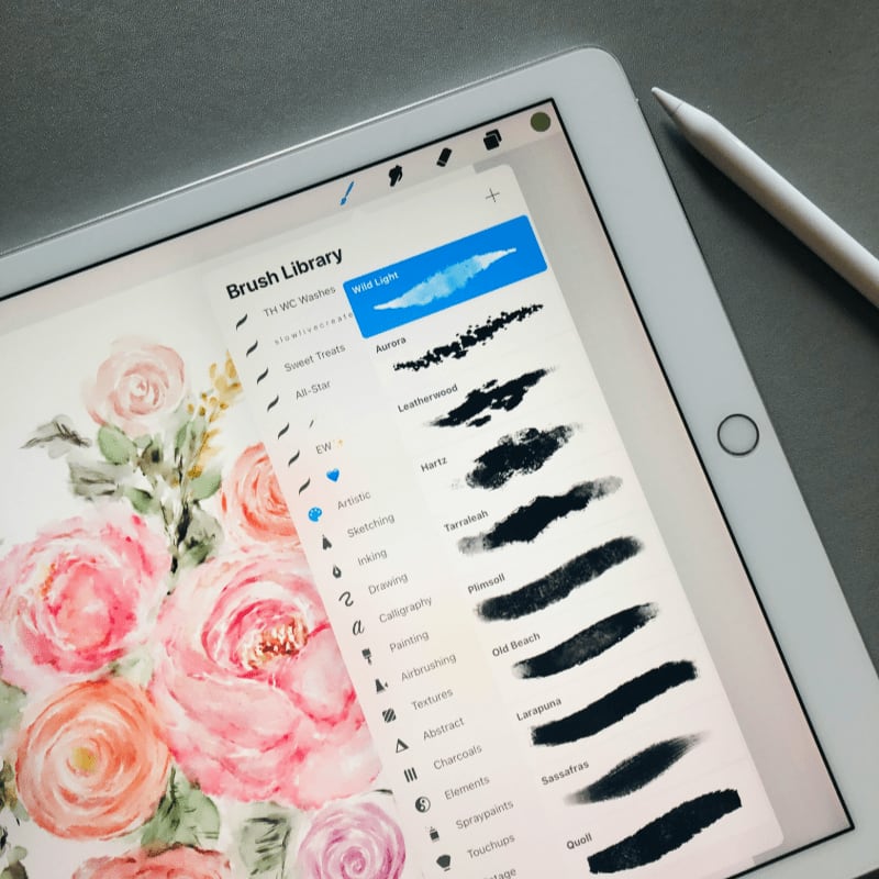 a tablet with a drawing of flowers on it