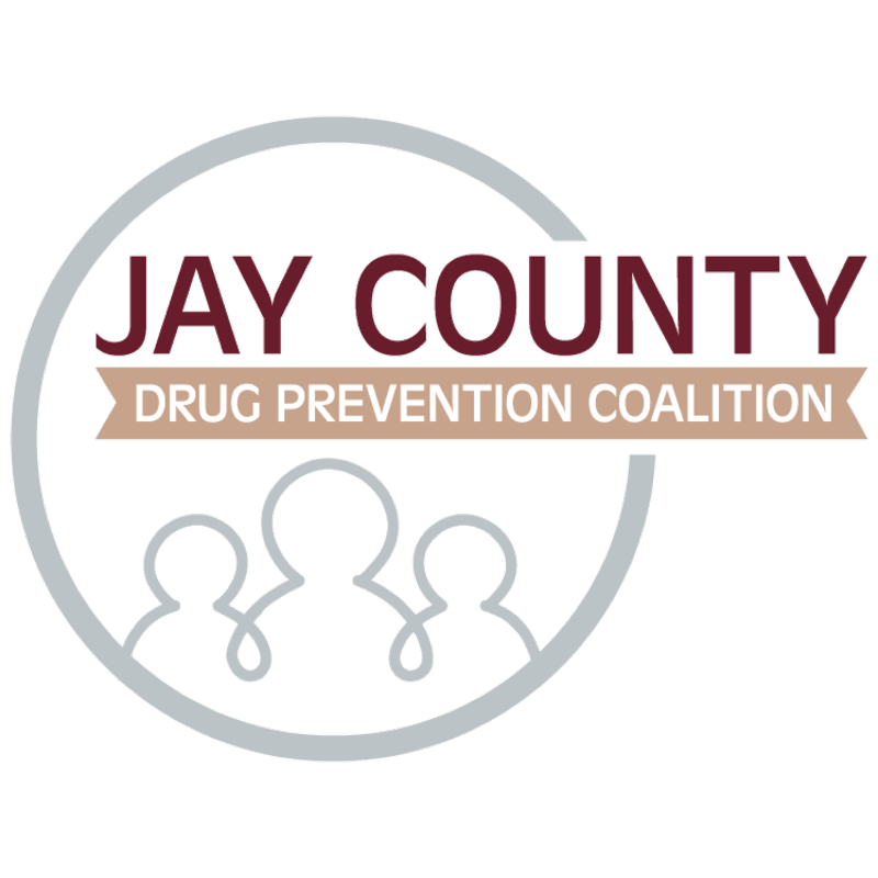 A logo featuring the text "JAY COUNTY DRUG PREVENTION COALITION" and stylized human figures inside a grey circle against a plain white background.