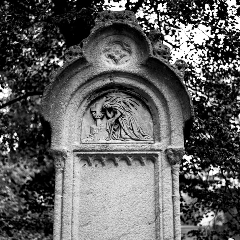 grayscale photo of concrete statue